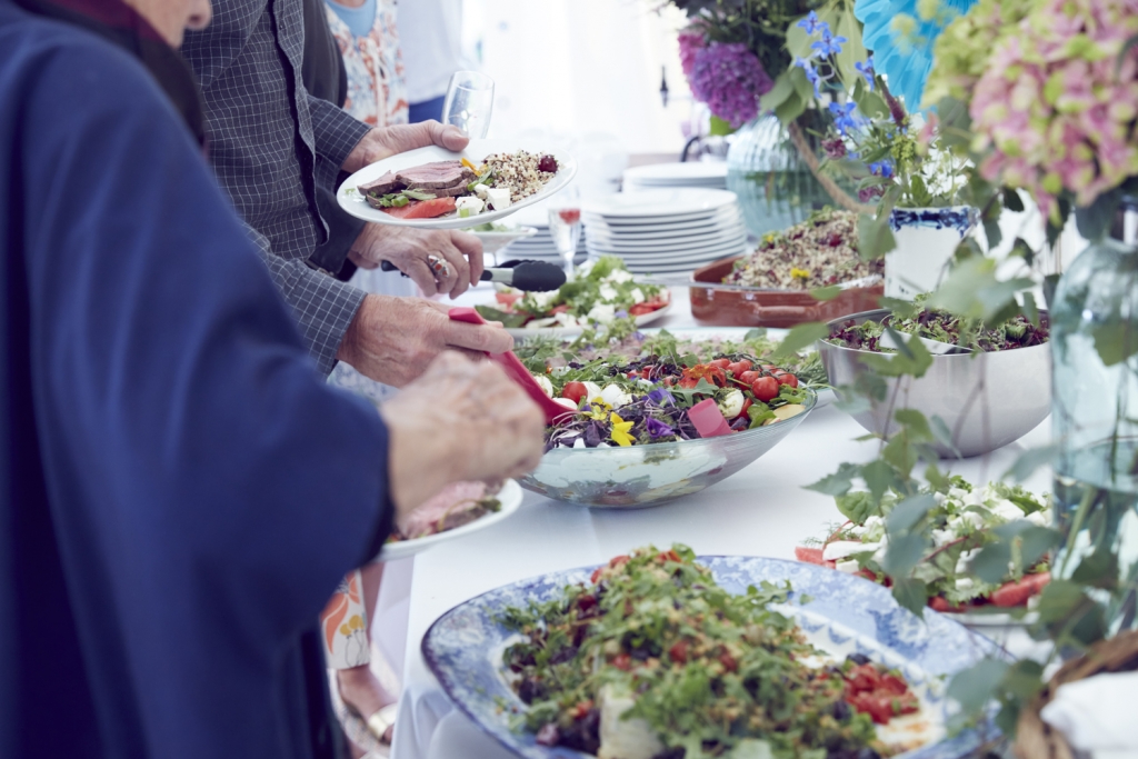 A delicious buffet style lunch is the most versitile choice for a relaxed summer garden party. Arrange food in large dishes and dress with fresh herbs and edible flowers. This spread was provided by Blid and Hatton