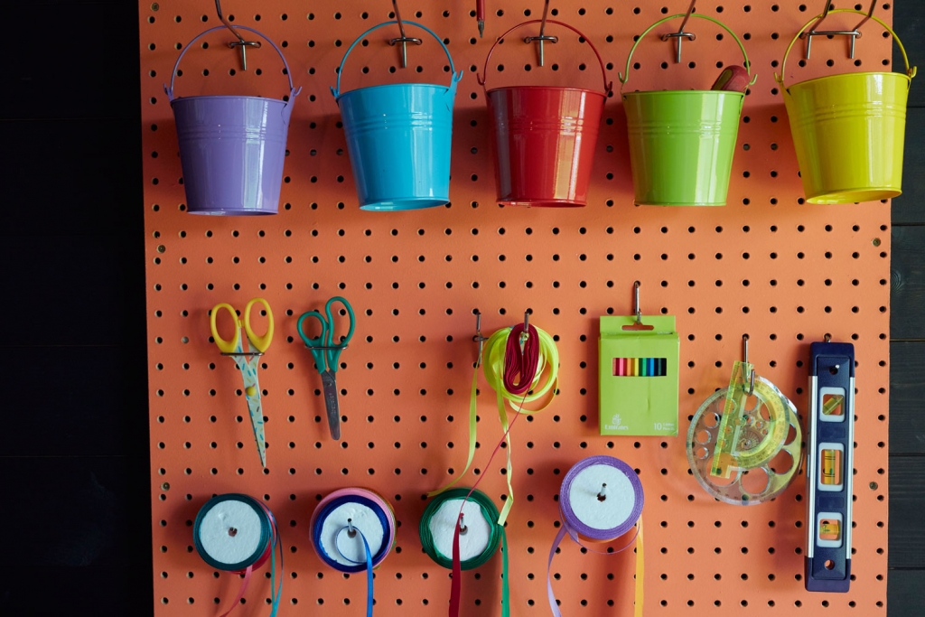 A peg board is the perfect way of maximising small spaces and getting storage up onto the walls. Every well interior designed space needs effective practical soloutions, especially creative spaces. Here all the craft and upcycling materials are kept in the same place.