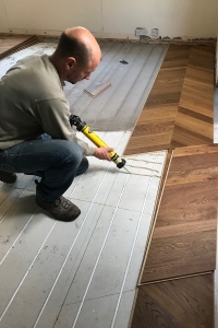 Tom laying Quick Step floor