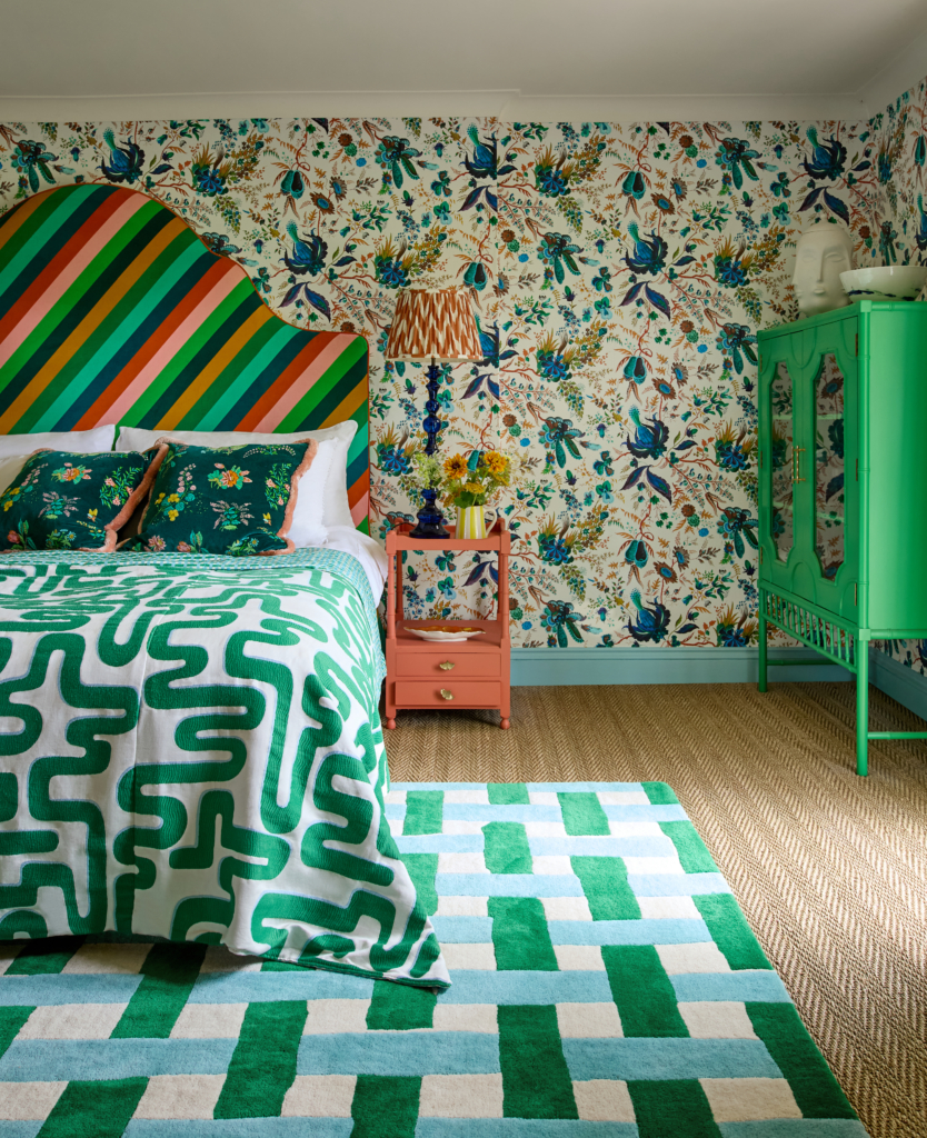 Maximalist bedroom with clashing patterns in various shades of green