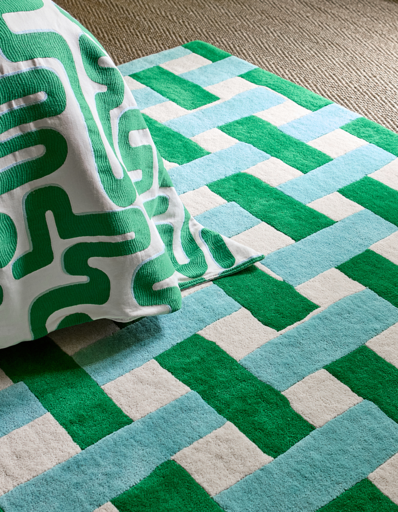 Maximalist basketweave rug with bold green bedspread